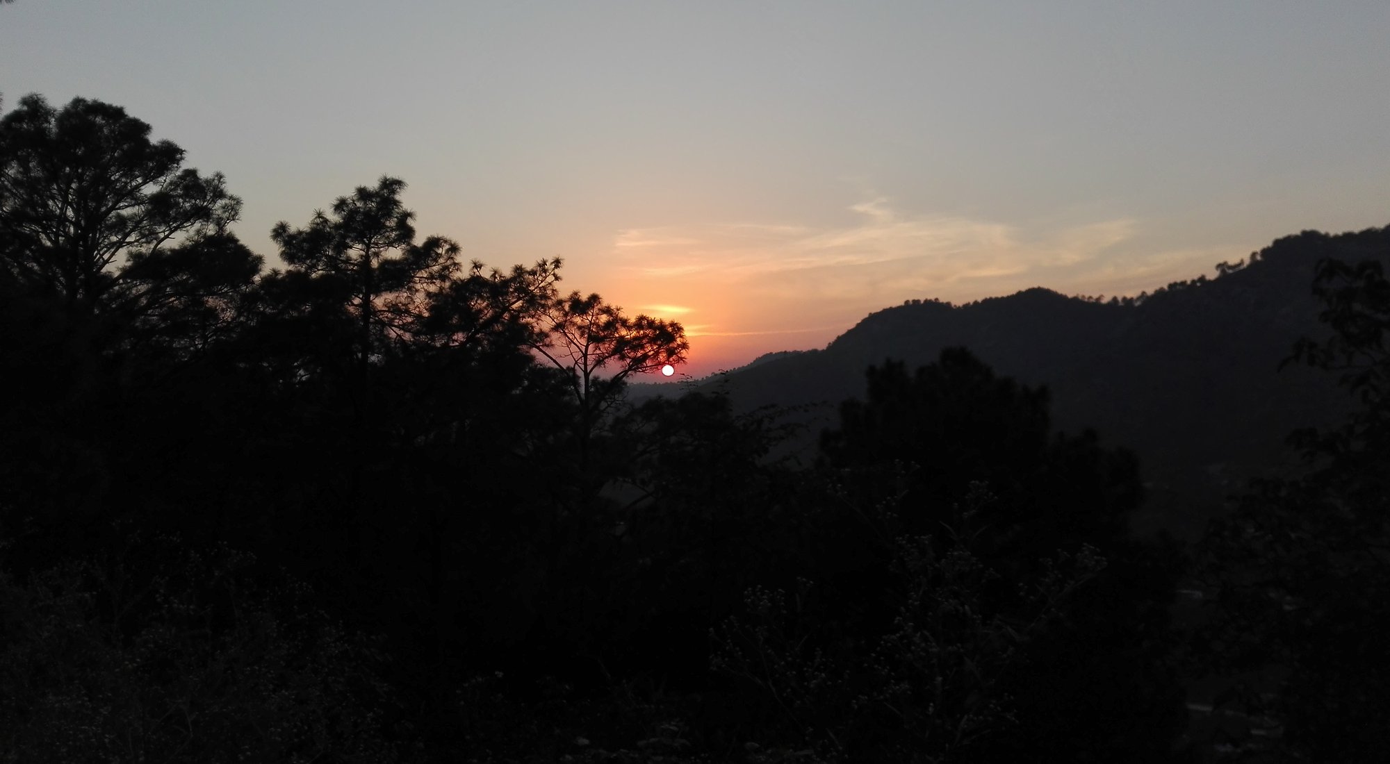 Sunset over the wooded Margalla Hills